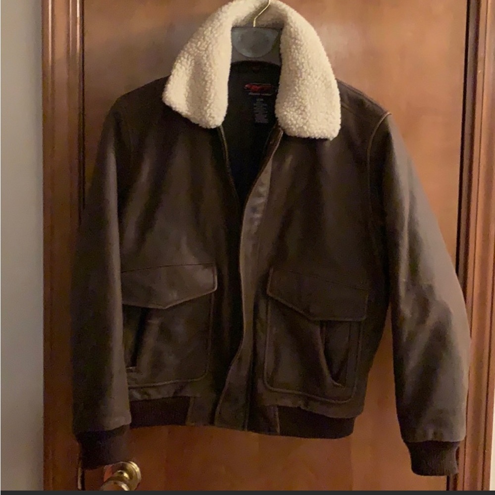Genuine Leather Bomber Jacket. Lining with
many pockets inside & out. Versatile.